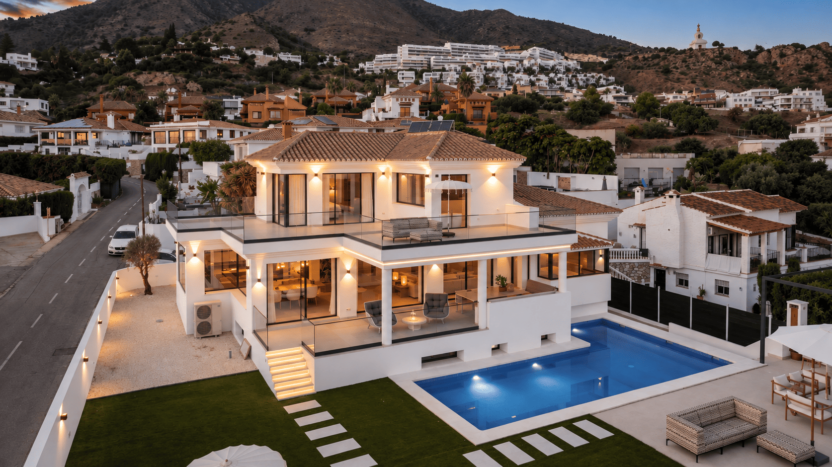 Renovated white villa and private pool at dusk in La Capellanía