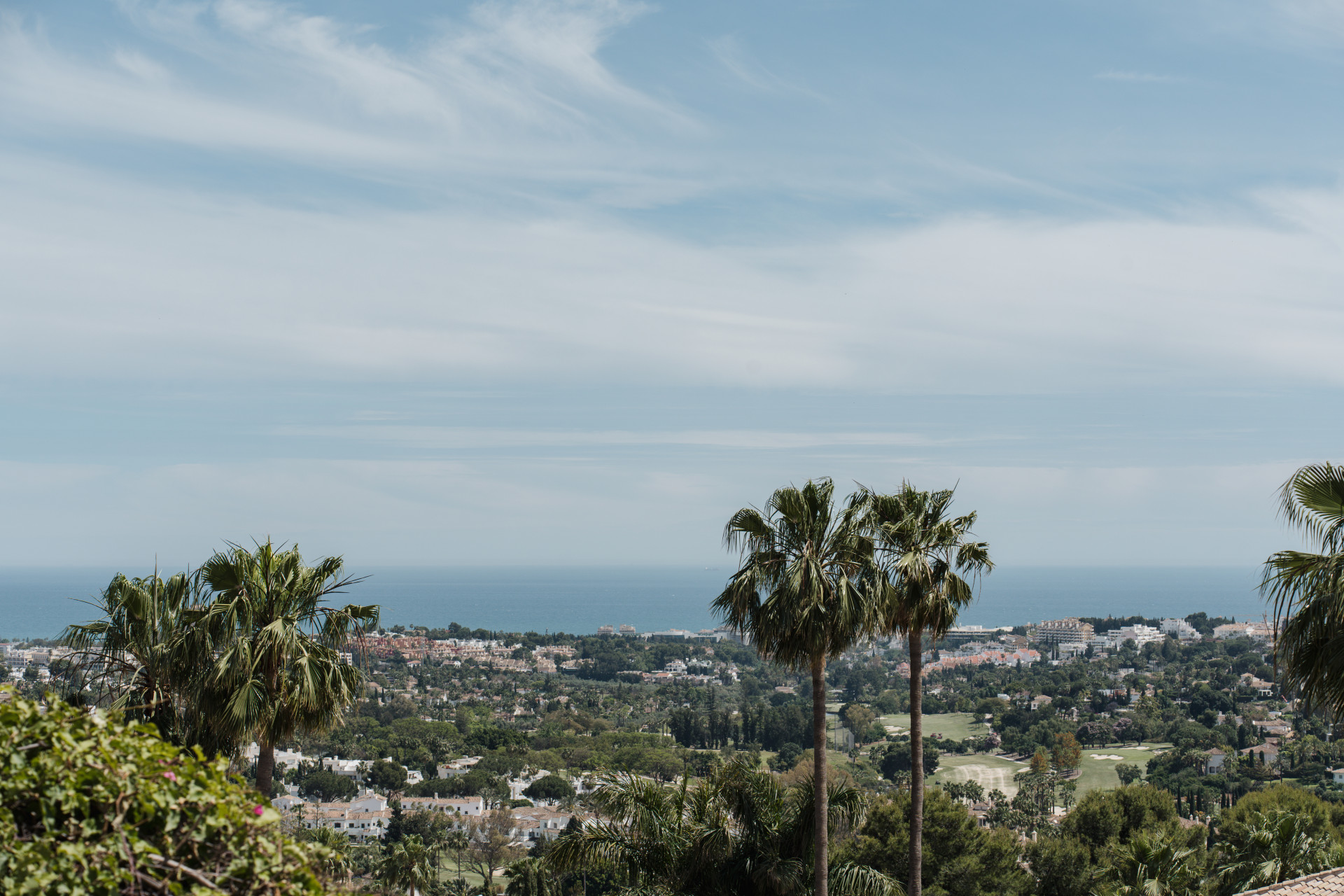Panoramic view across Nueva Andalucia's golf landscape towards the Mediterranean Sea