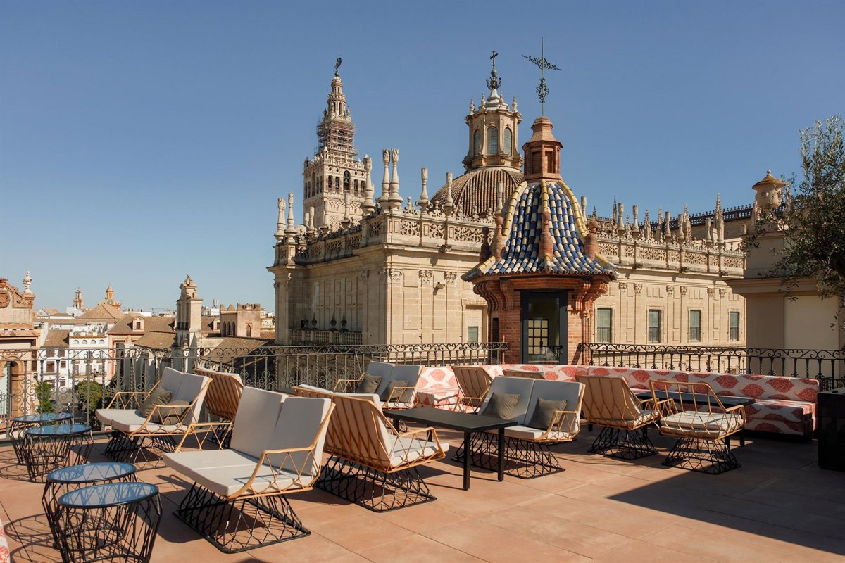Serras Sevilla rooftop seating with Seville Cathedral and the Giralda beyond